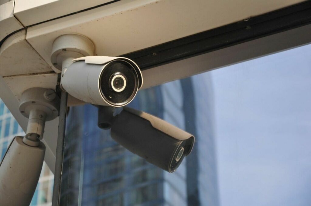 CCTV camera placement outside reflected in window
